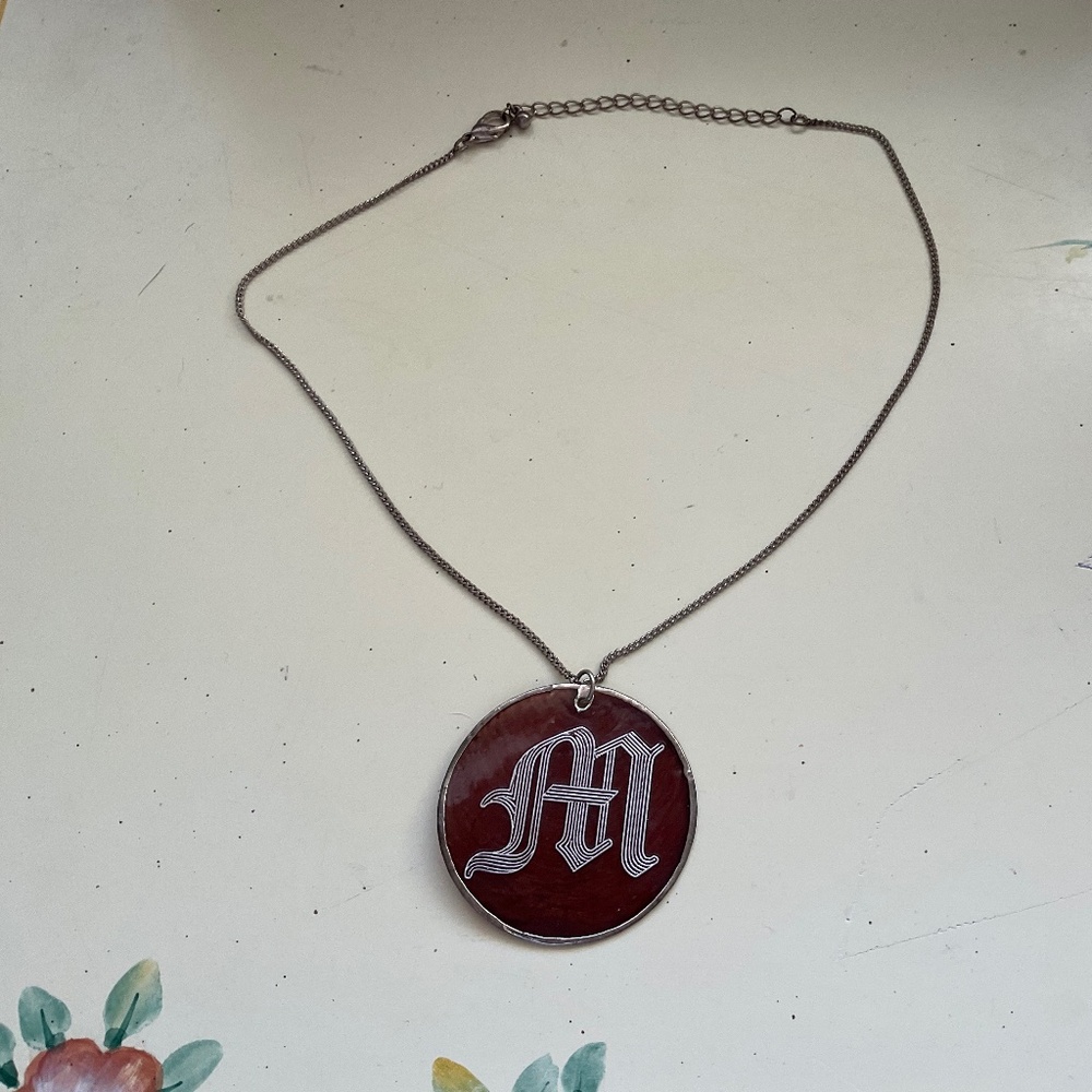 Vintage “M” initial necklaces, etched in glass, copper background, 18”.